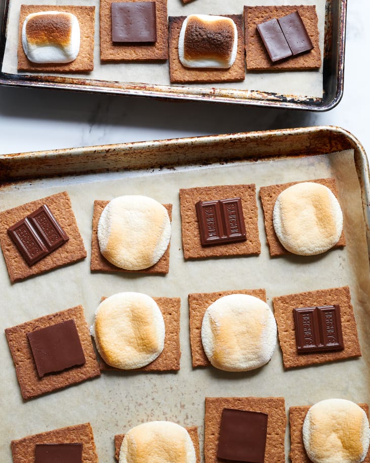 S'mores are laid out on sheet pans.