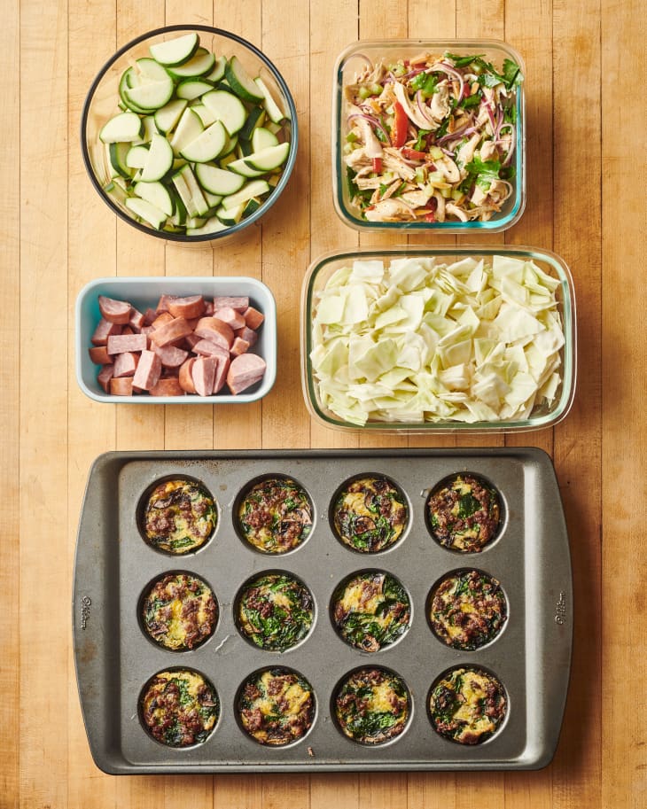 ingredients to keto meal prep in various baking dishes on a table