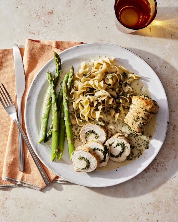 chicken rollups on a plate with asparagus