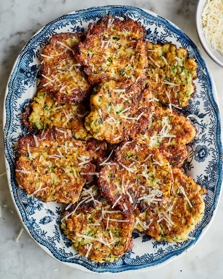 zucchini fritters garnished with parm on a plate