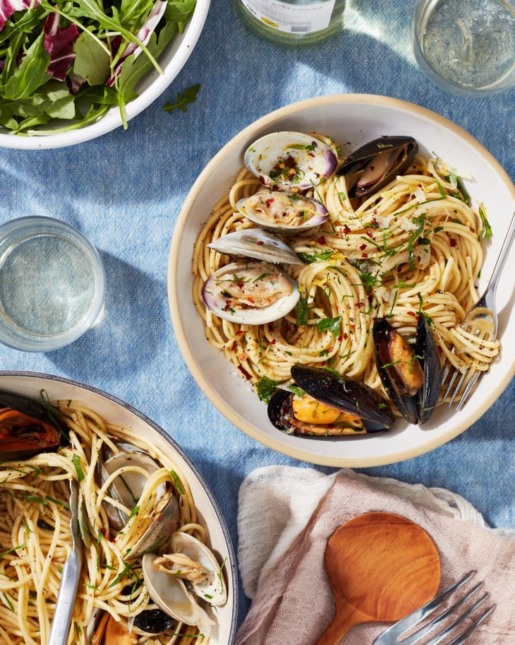 Spaghetti with mussels and clams served in bowl.