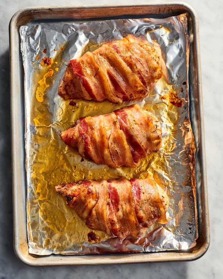 bacon wrapped chicken on foil