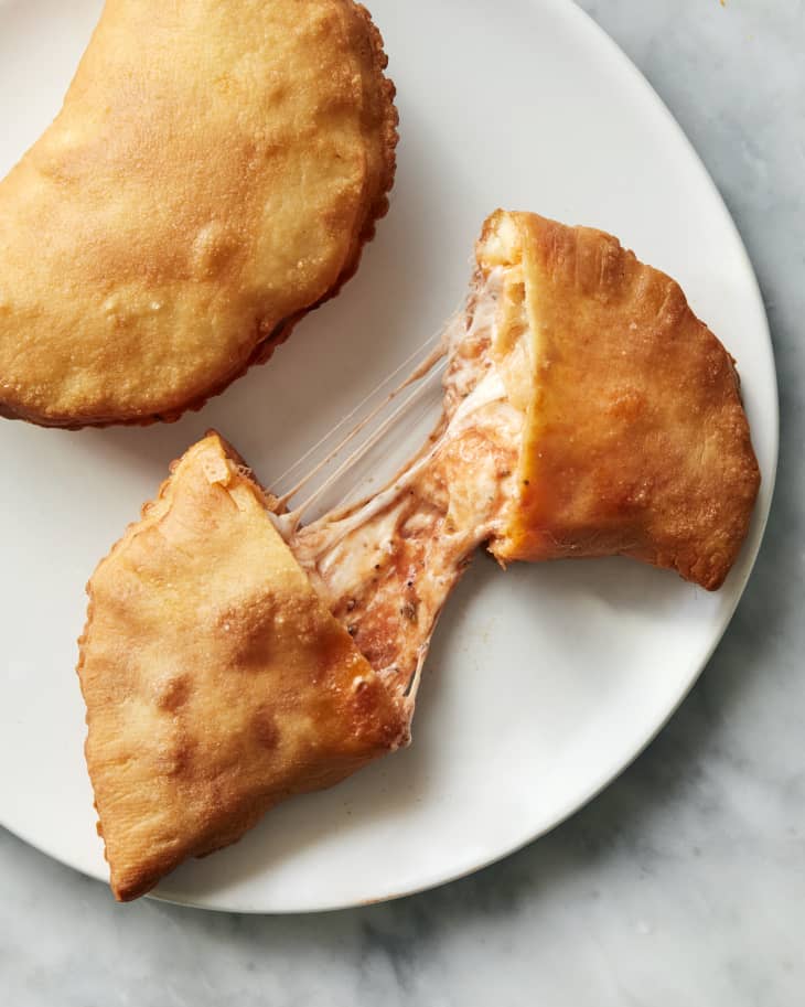 panzerotti split open with cheese pull on plate
