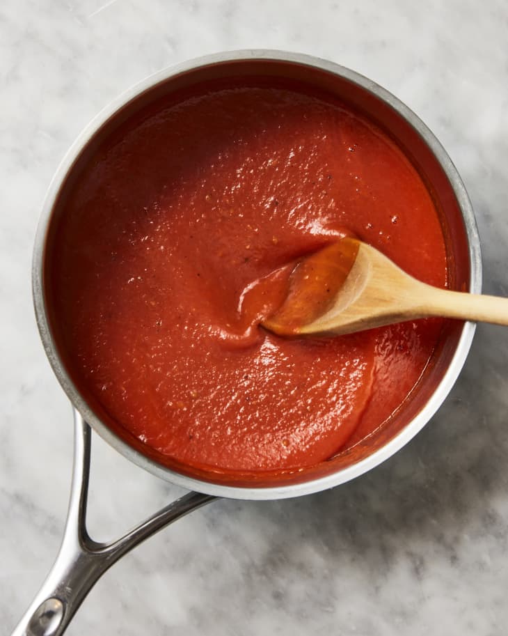 red sauce in pot with spoon