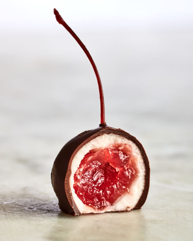 a single chocolate covered cherry, halved