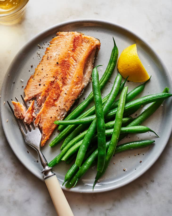 Crispy skinned seared trout on a plate