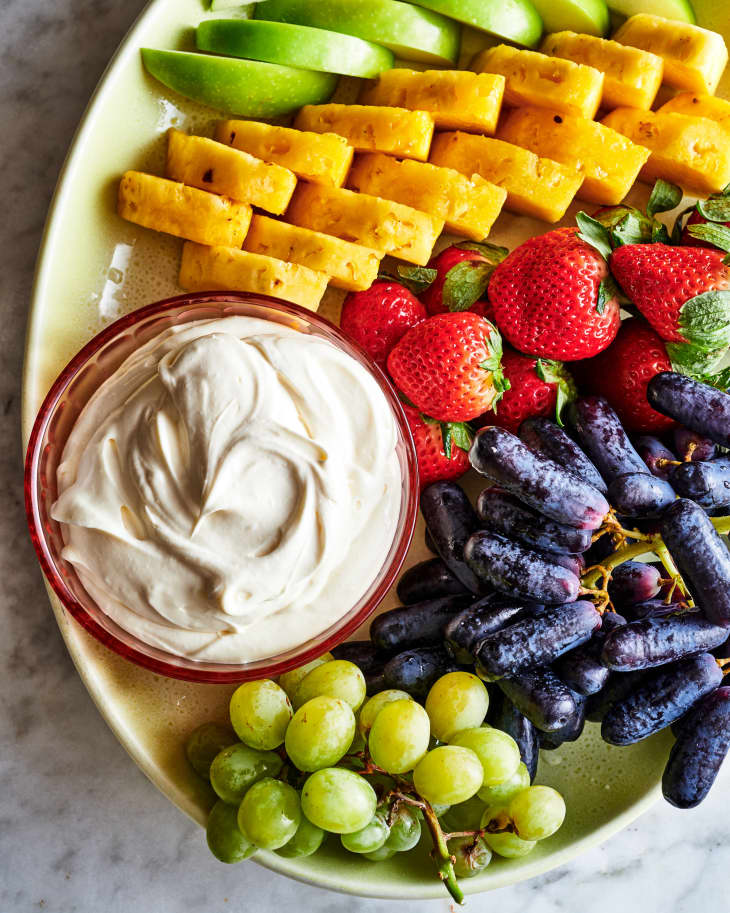 a platter of fruit, with fruit dip