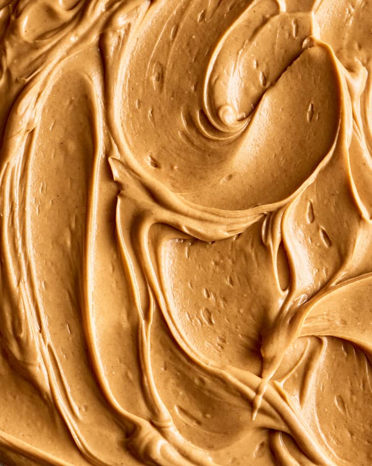 macro shot of peanut butter frosting spread