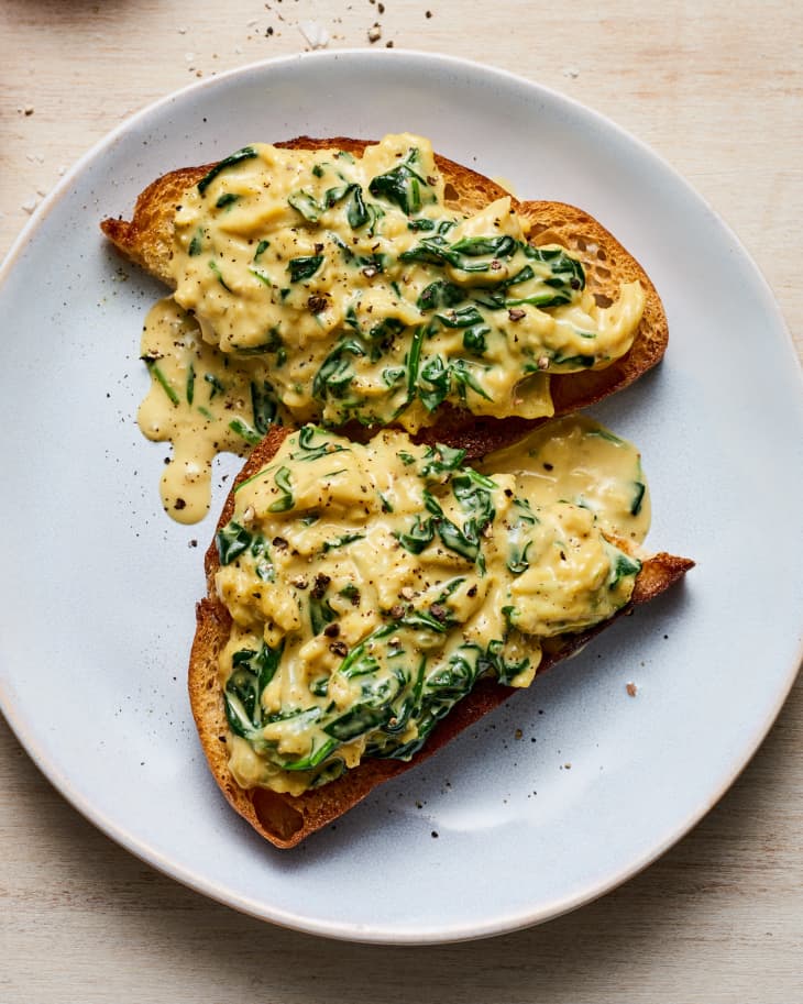 Creamed Spinach Scrambled Eggs served on a piece of bread