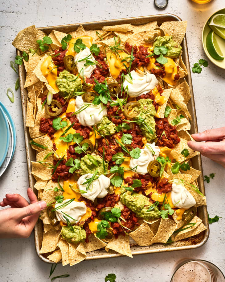 sheetpan of nachos at a table
