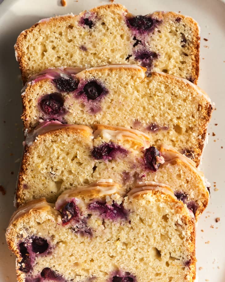 lemon blueberry bread loaf from above with slices sliced off
