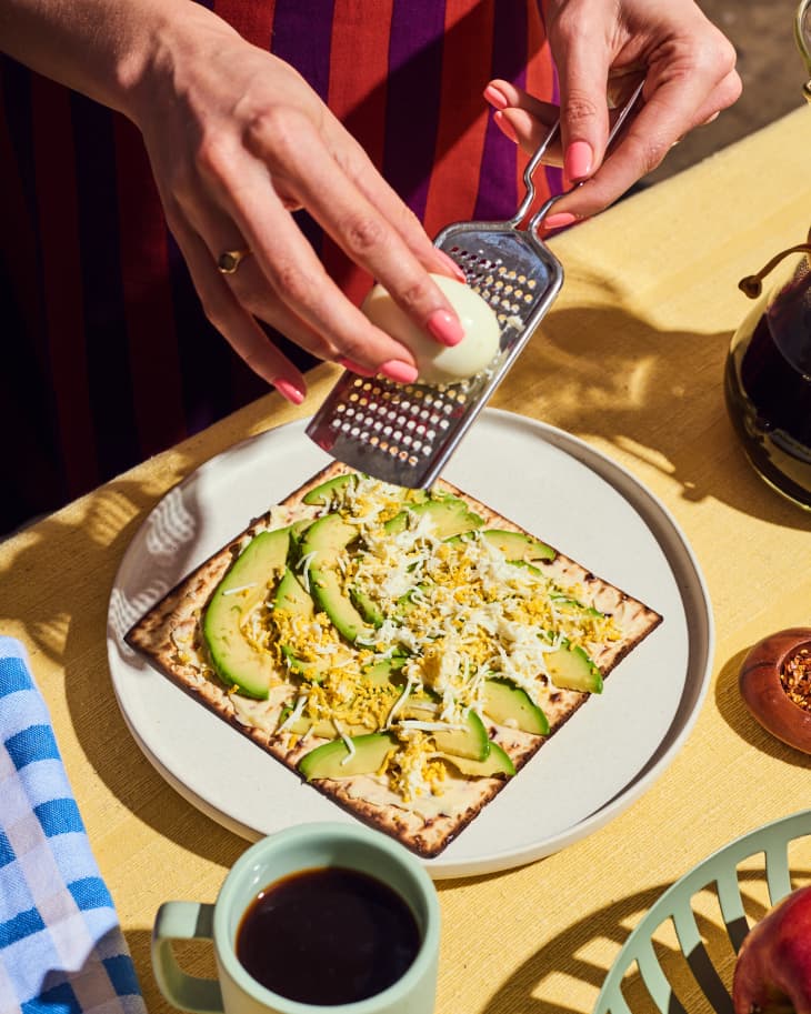 Matzo with Avocado &amp; Grated Egg, with egg being grated at the table