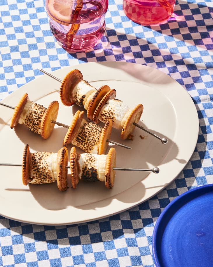 stores skewers on a plate with blue checkered background