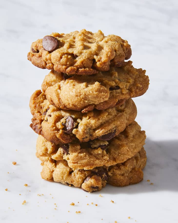 Peanut butter chocolate chip cookies stacked.