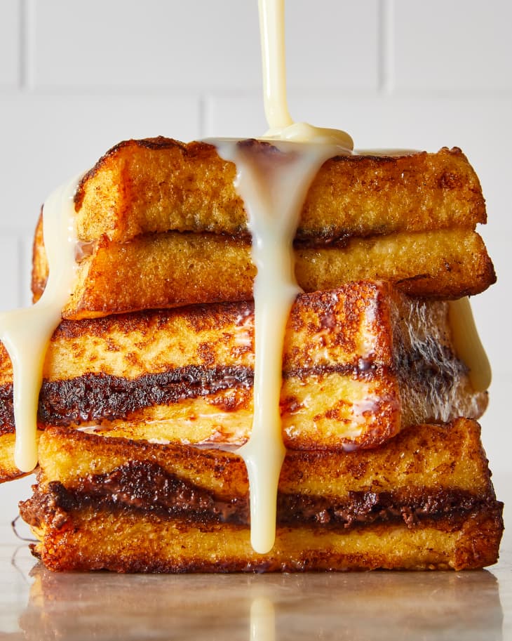 condensed milk being poured over French toast