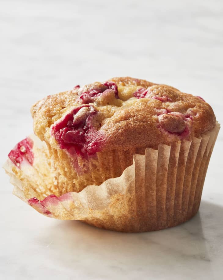 Cranberry orange muffin on surface.