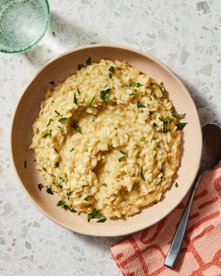 bowl of vegan risotto with fresh parsley garnish