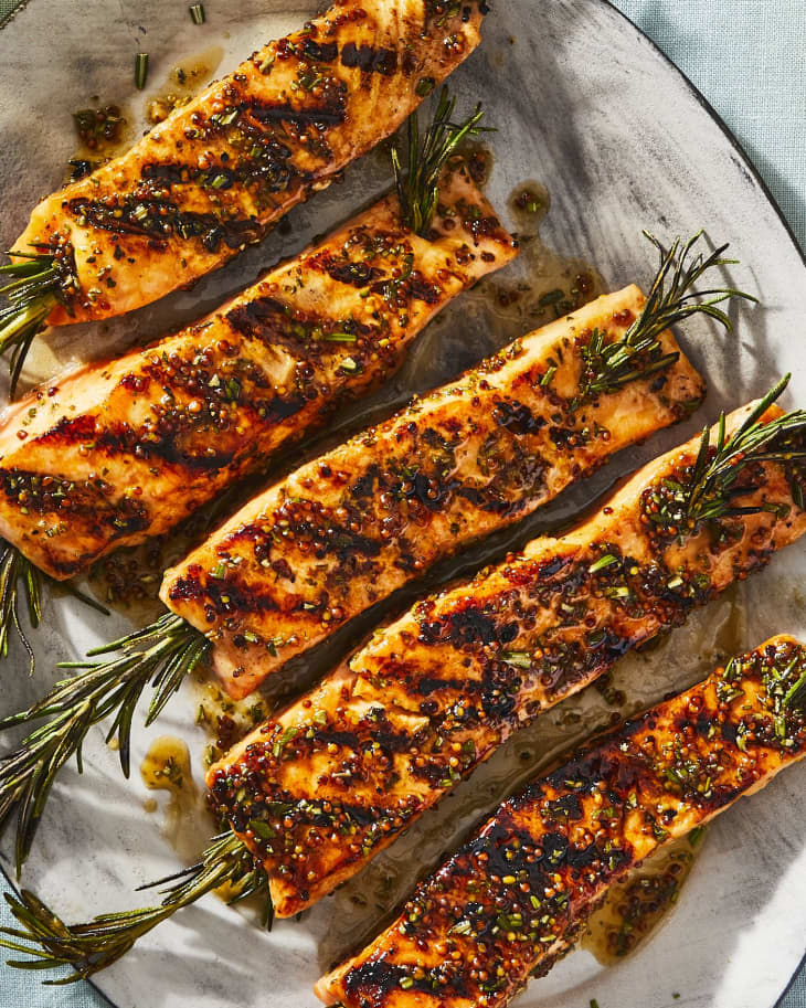 rosemary salmon skewers on  a plate