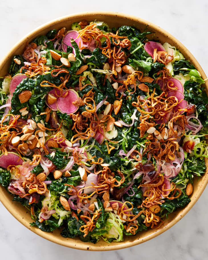 A big bowl of make-ahead holiday salad topped with fried shallots and watermelon radishes.