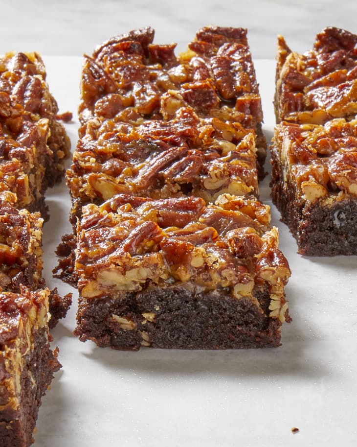 Angled view of rows of pecan pie brownies.
