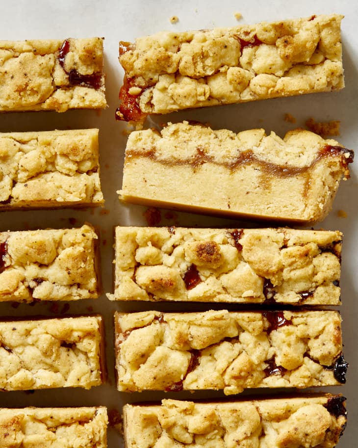 Overhead view of cut up shortbread on marble surface.