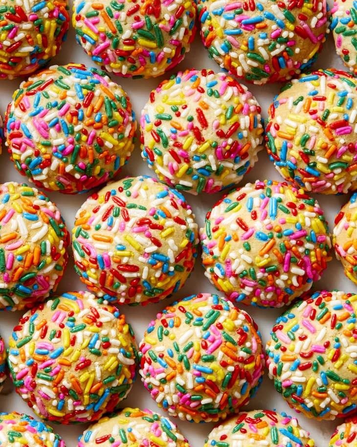 Overhead view of sprinkle cookies on butcher paper.