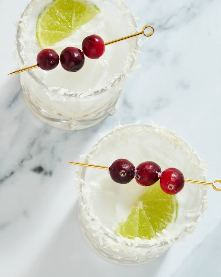 margarita with cherries and lime garnish in glasses