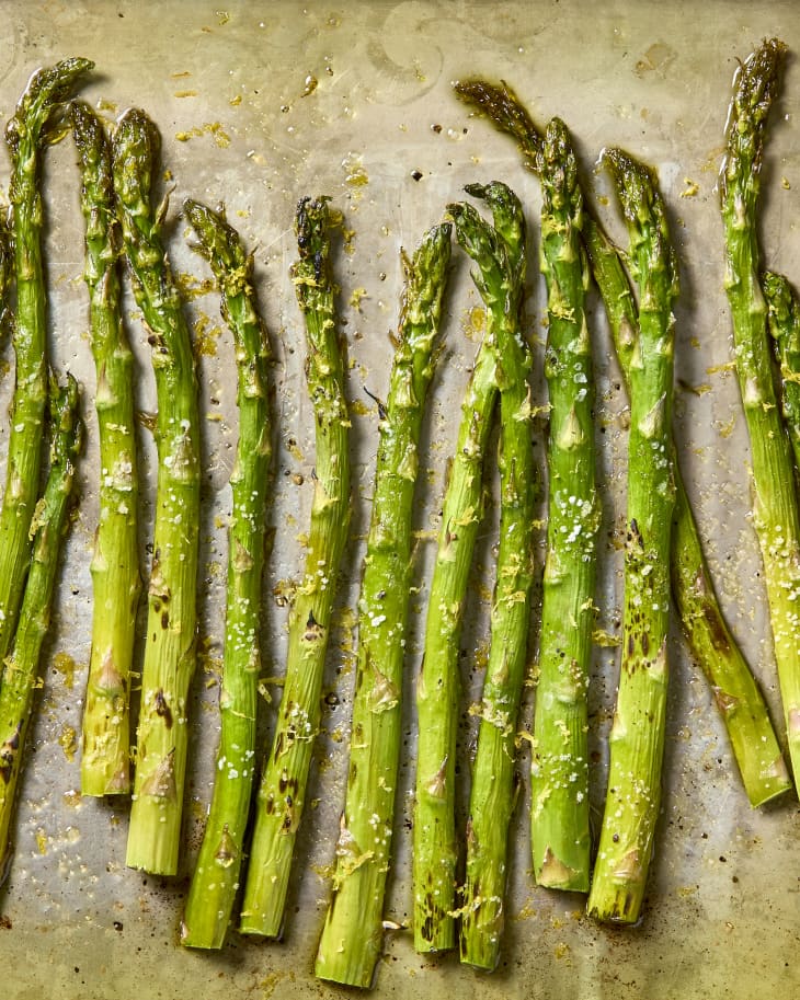 Fully cooked asparagus on a sheet pan.