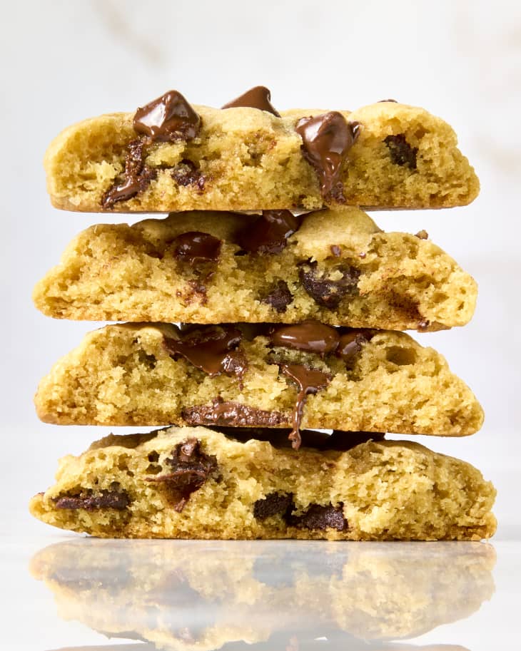 head on shot of a stack of four chocolate chip cookies.