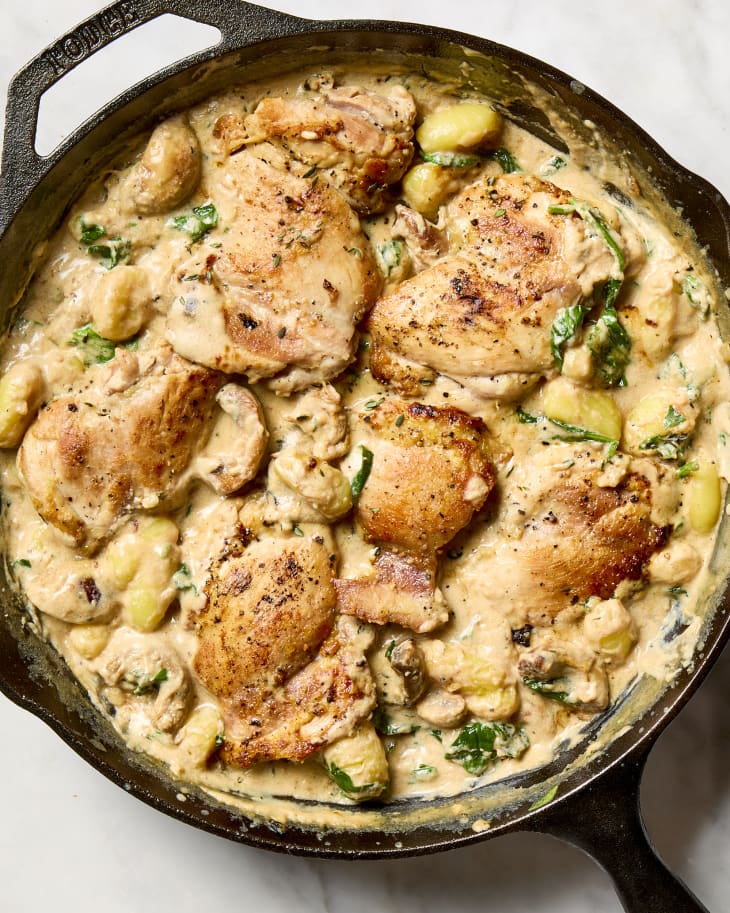 overhead shot of one pan garlic parmesan chicken gnocchi in a cast iron skillet.