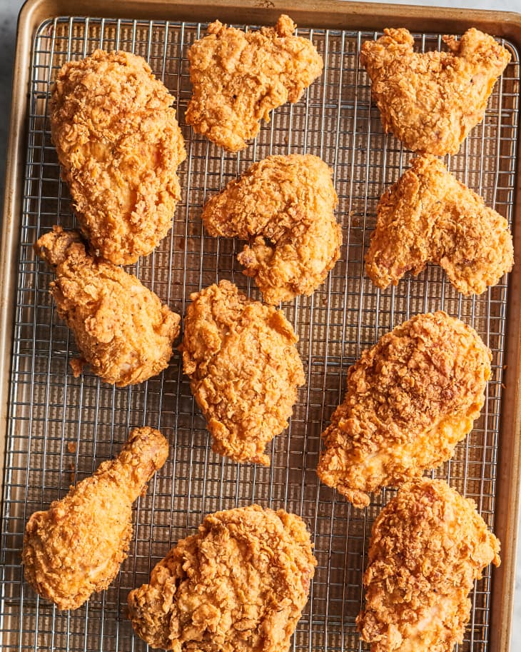 fried chicken pieces on a cooling rack