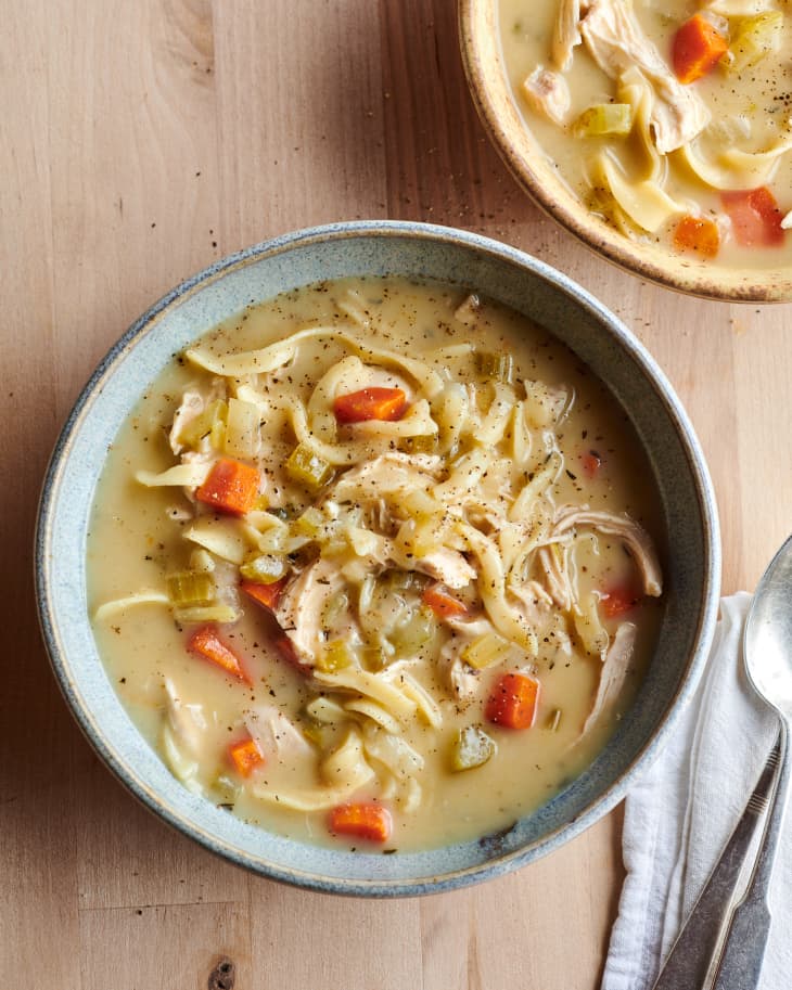 Creamy chicken noodle soup in bowl.