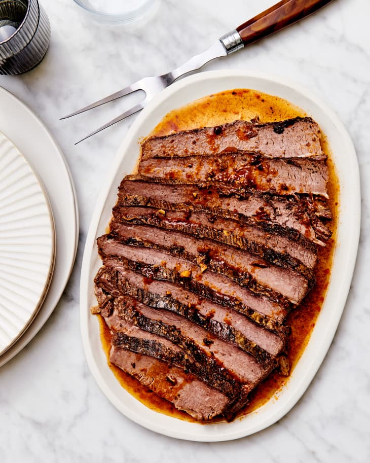 brisket on a platter with wine