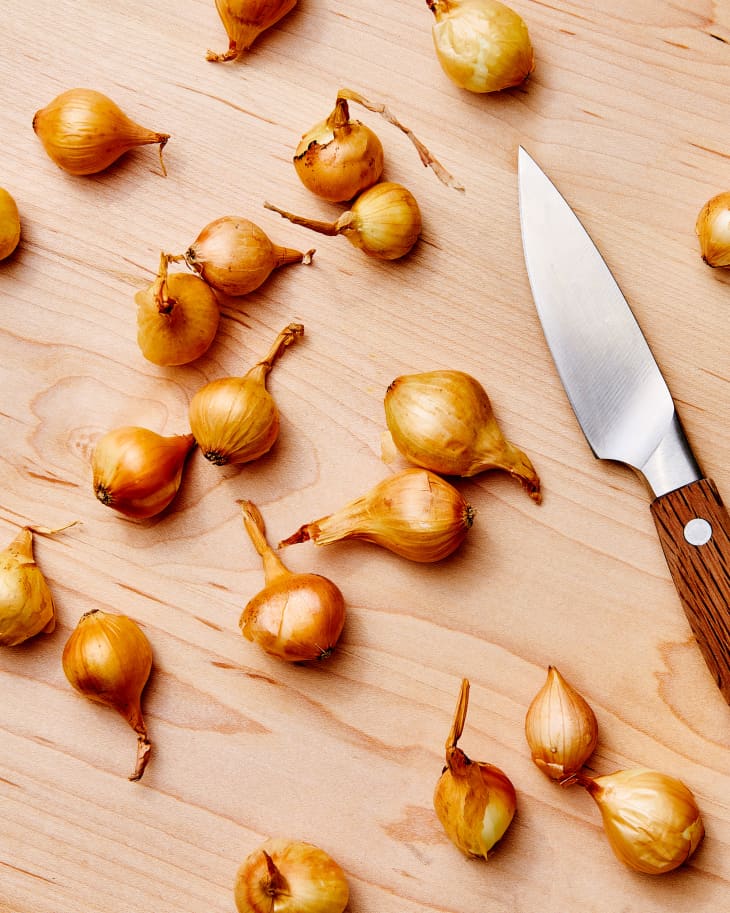 pearl onions on cutting board
