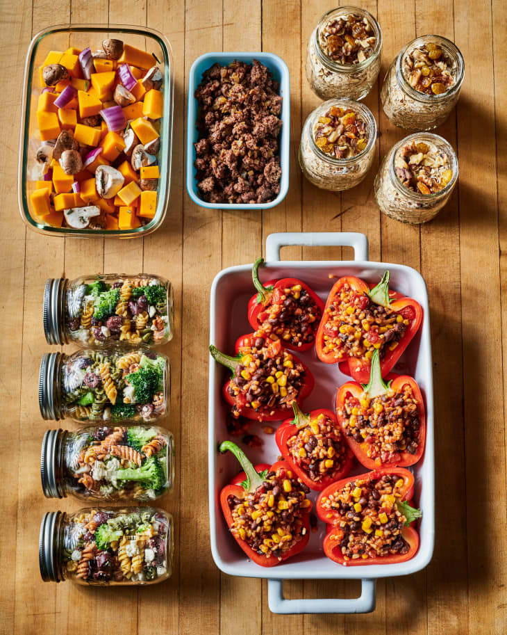 Stuffed red bell peppers with corn and beans, jars of pasta salad, diced squash, mushrooms, and overnight oats.