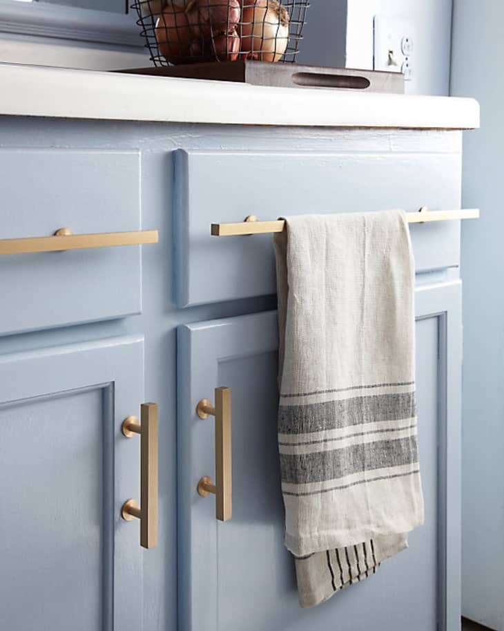 Kitchen Details: Brushed Brass Cabinet Pulls Against Light Blue Cabinets