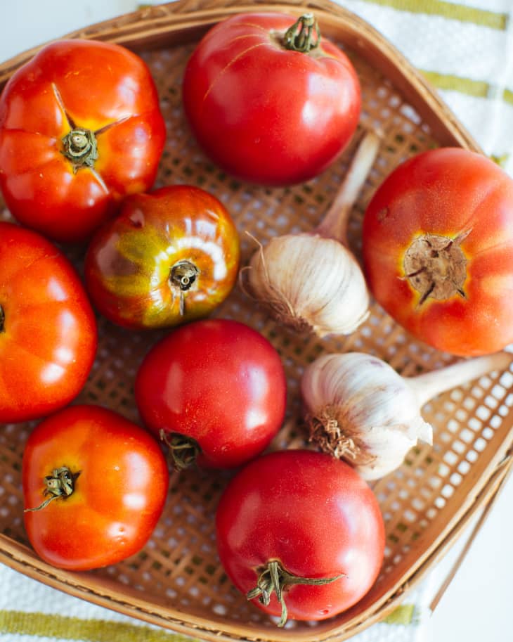 A basket of tomatoes and garlic