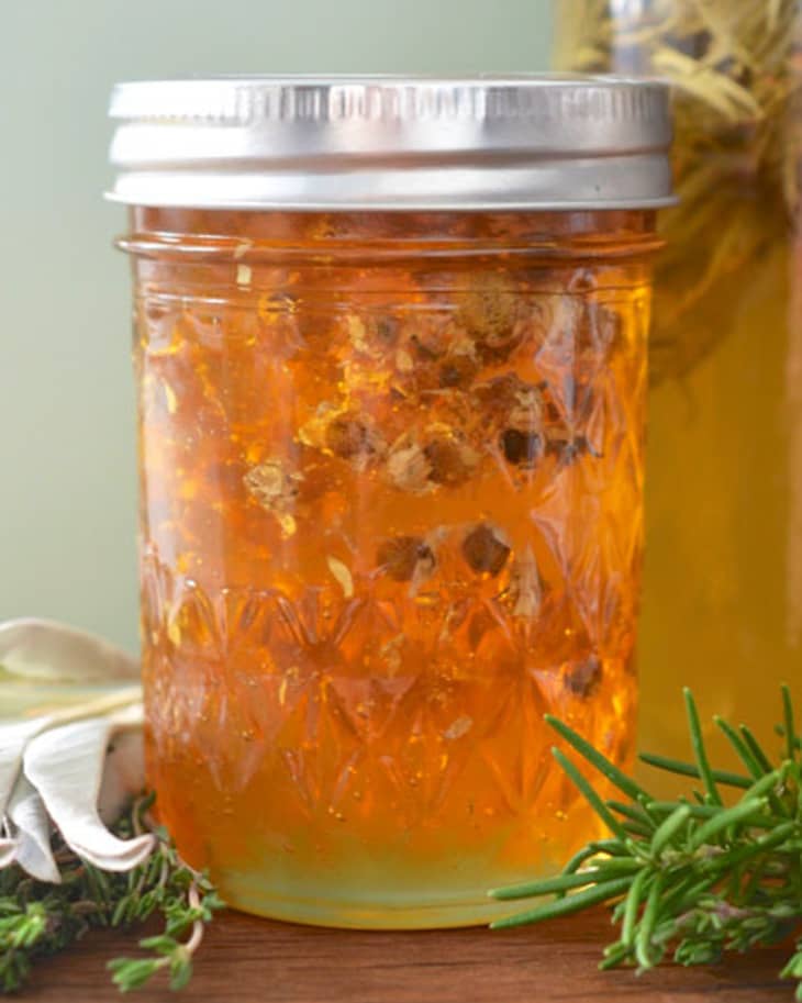 Colorful Honey With Fruit And Nuts Canned In The Glass Jar, On A