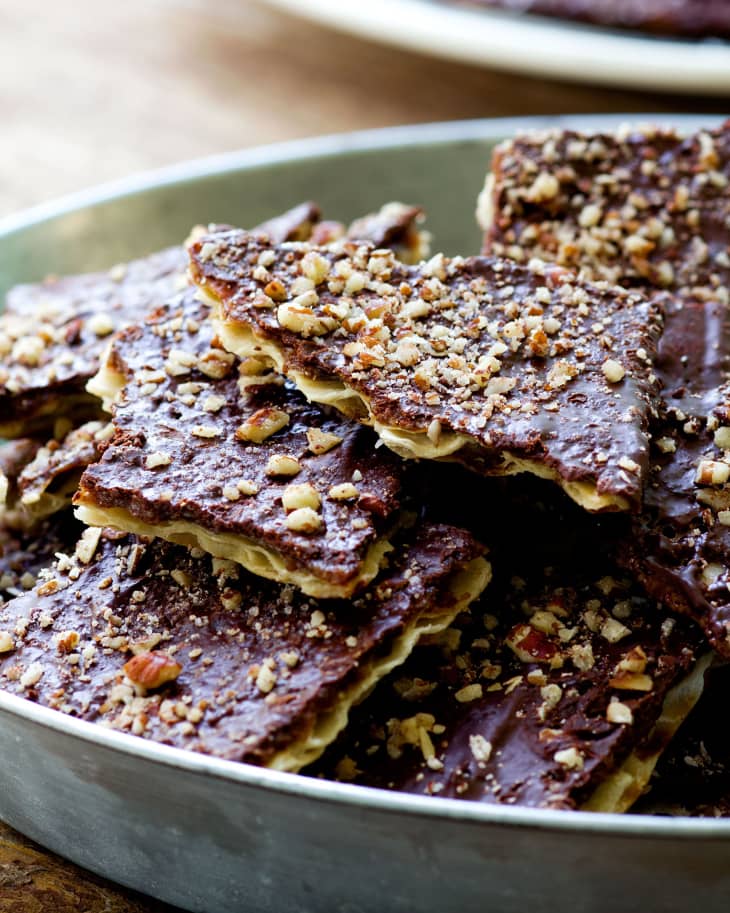 Pieces of chocolate caramel matzo brittle in a wide bowl