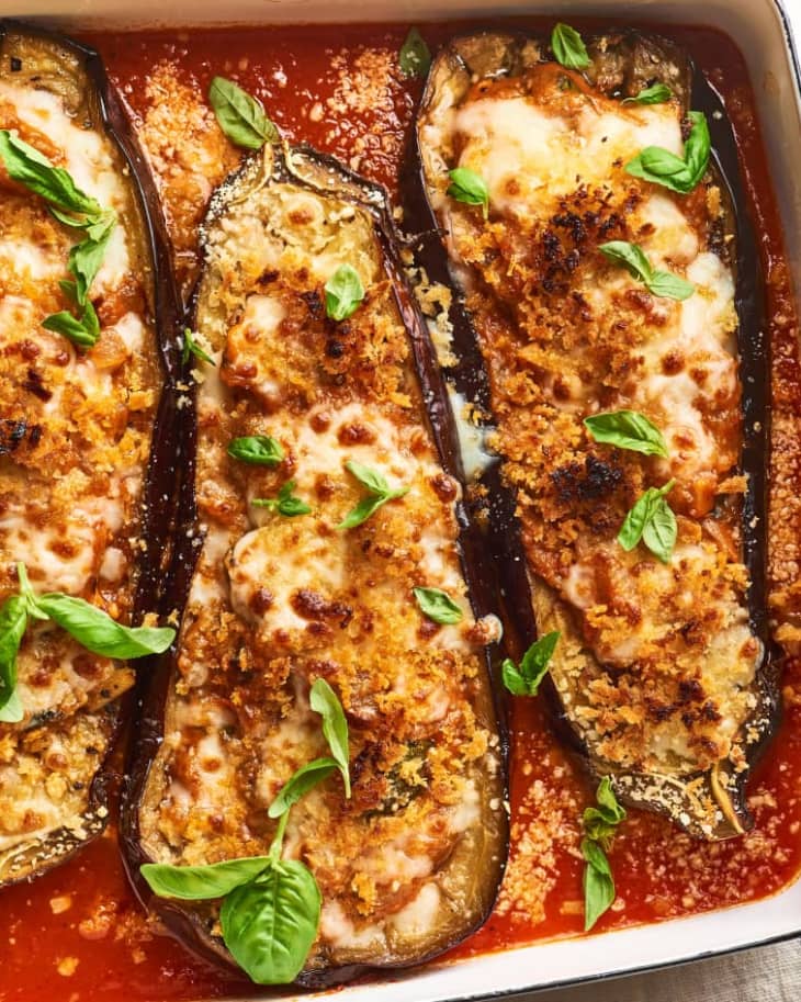 Stuffed eggplant Parm topped with mozzarella cheese and garnished with basil