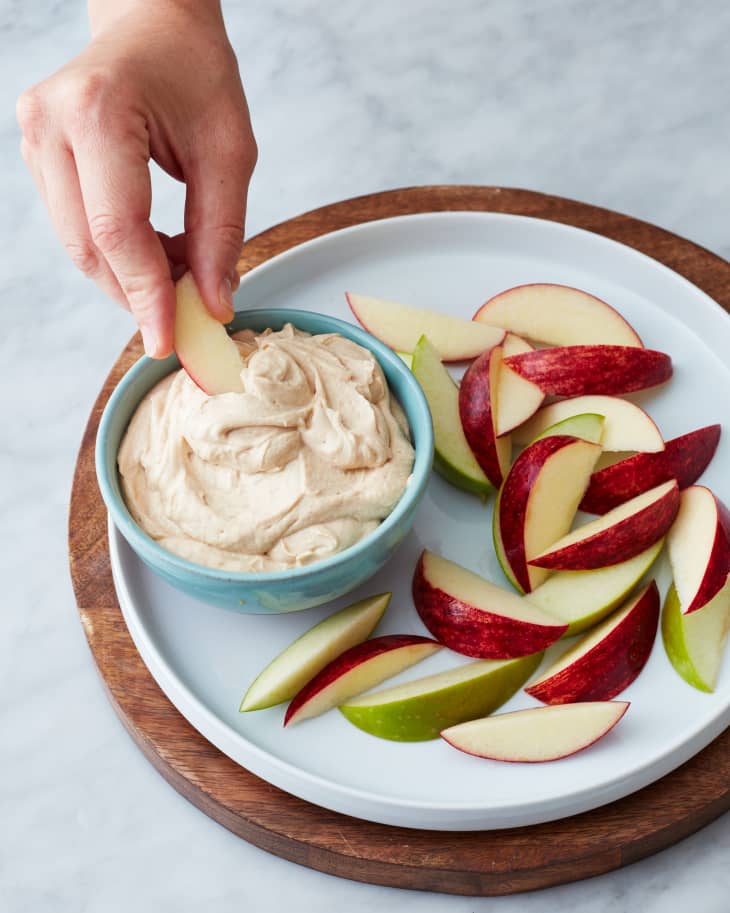 A plate of apple slices with 3-ingredient peanut butter fruit dip
