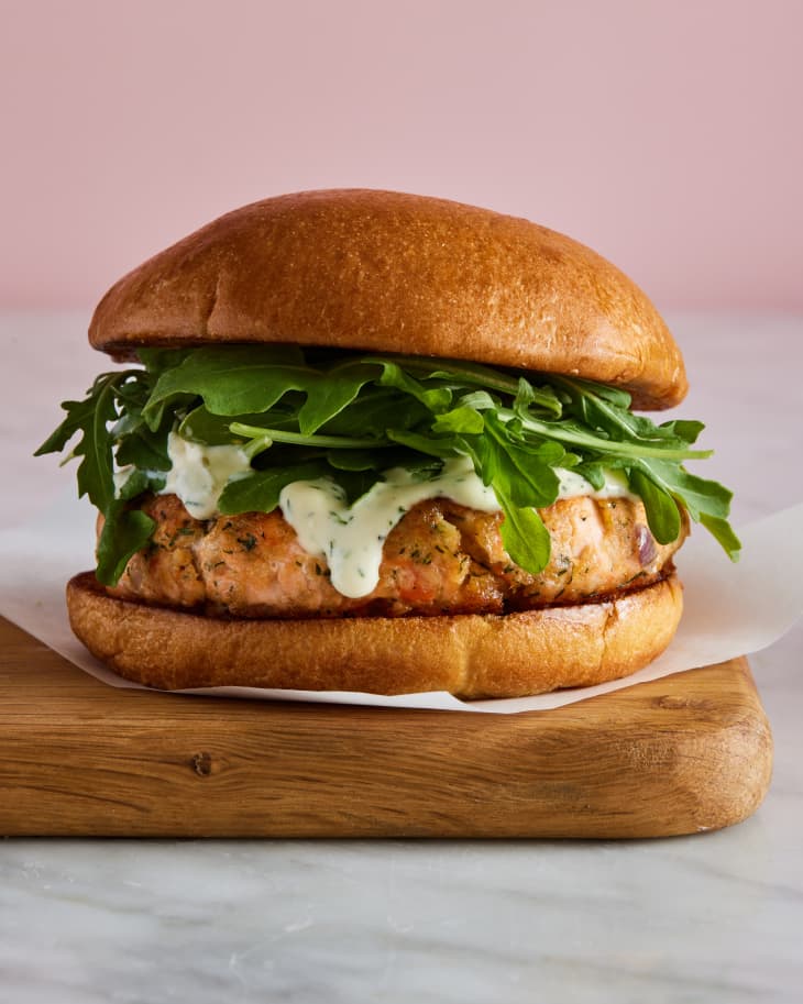 salmon burger on wooden board