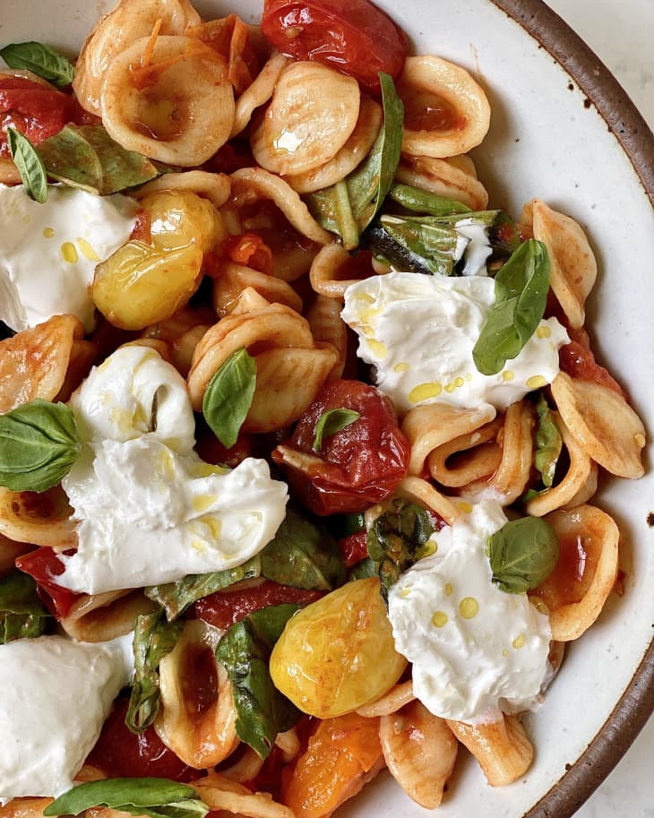 ricotta, cheese, mini shell noodles, basil, cherry tomatoes, bowl of pasta, clumps of cheese