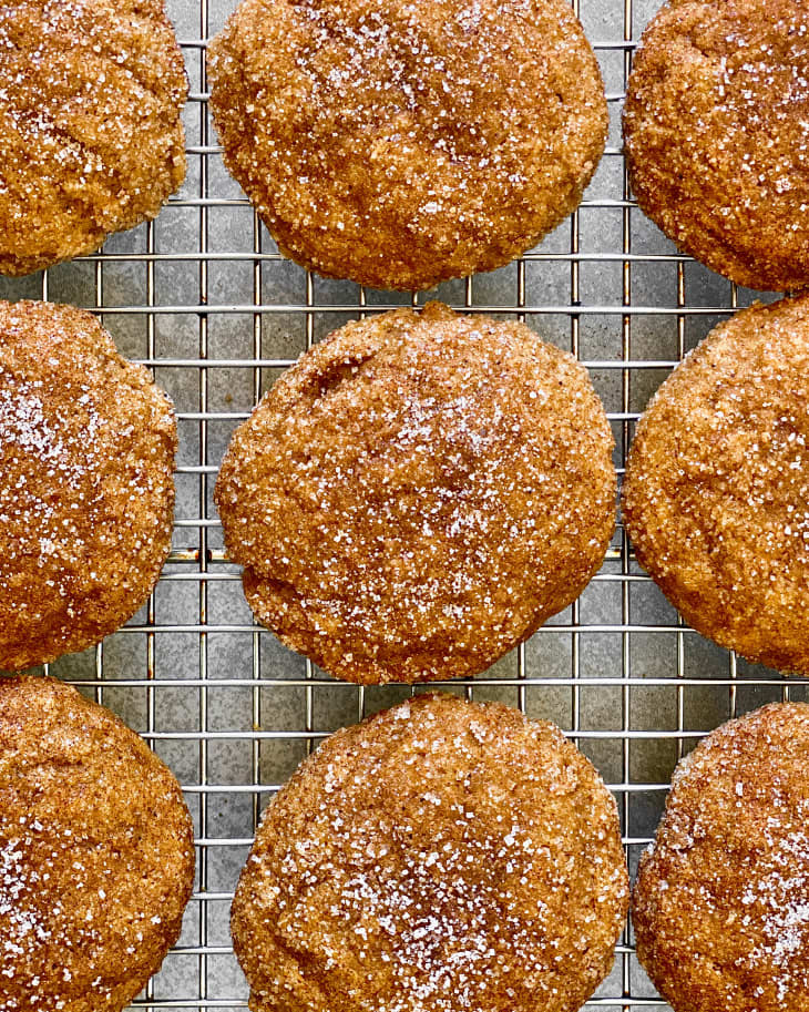 pumpkin cookies with granulated sugar on top sitting on cooling rack