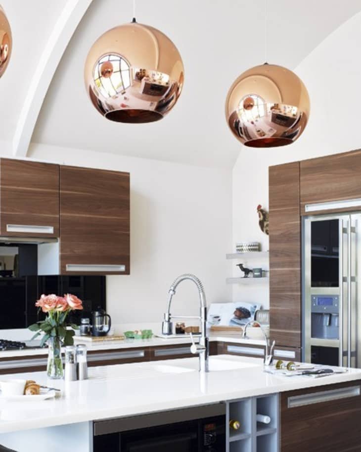Copper pendant lights over kitchen deals island