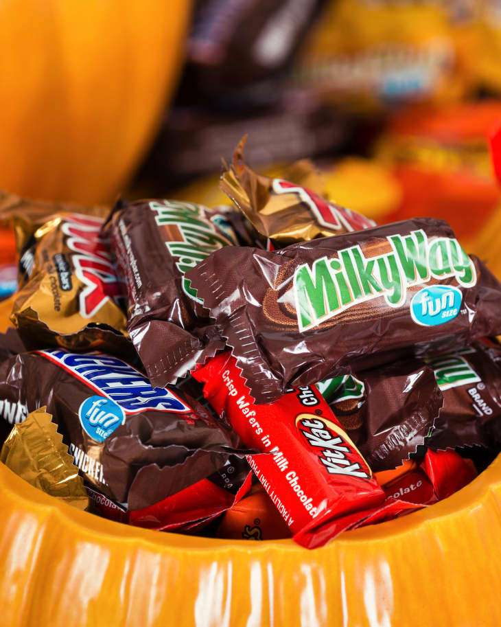 Decorative pumpkins filled with assorted Halloween chocolate candy made by Mars, Incorporated and the Hershey Company.