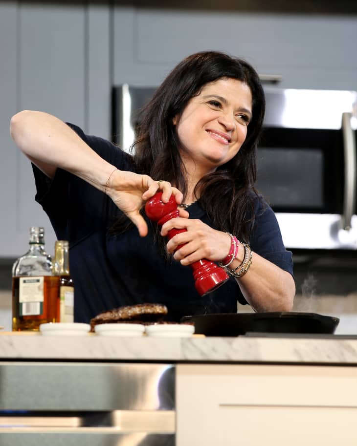 Chef Alex Guarnaschelli prepares food on stage during the Grand Tasting