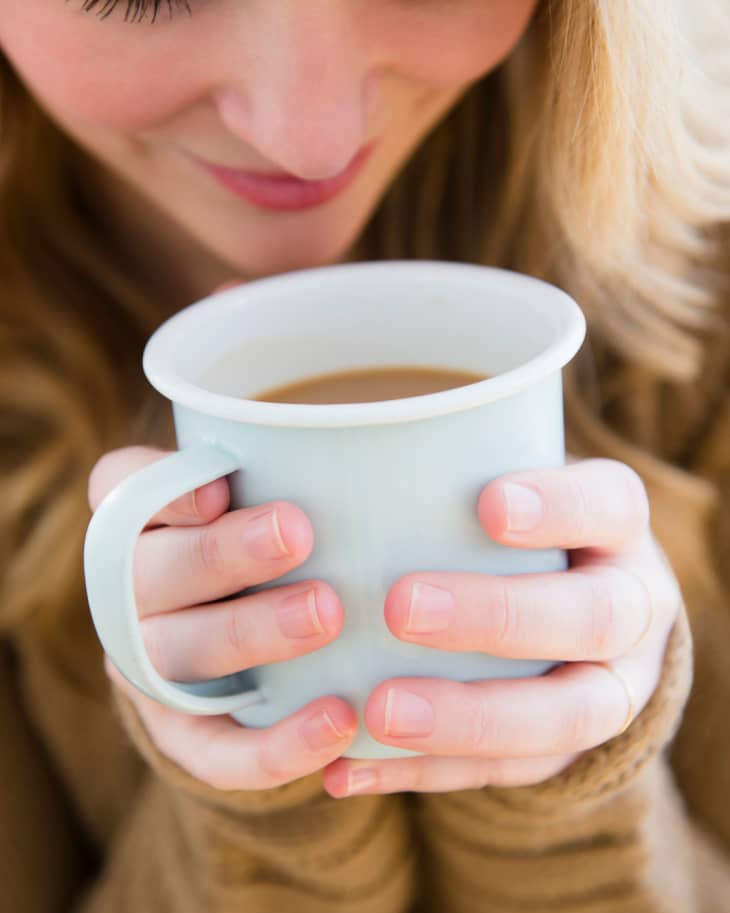 Woman holding coffee mug