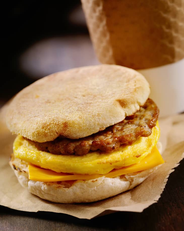Sausage, Egg and Cheese Breakfast Sandwich on a Toasted English Muffin with a Take Out Coffee- Photographed on Hasselblad H3D2-39mb Camera