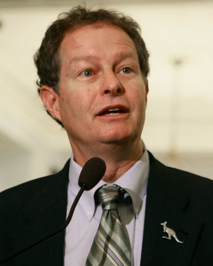 Whole Foods CEO John Mackey speaking into a microphone